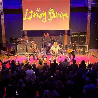Living Colour on stage under their name in lights, the crowd's hands raised